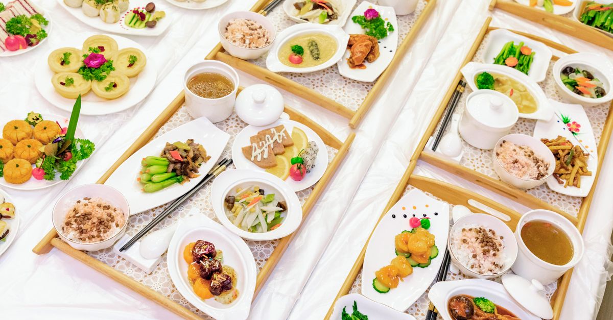 Beautifully arranged Asian dishes featuring a variety of gourmet delicacies and traditional culinary craftsmanship.